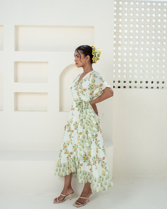 Model wearing the Anar Bagh yellow floral hand block printed cotton wrap dress