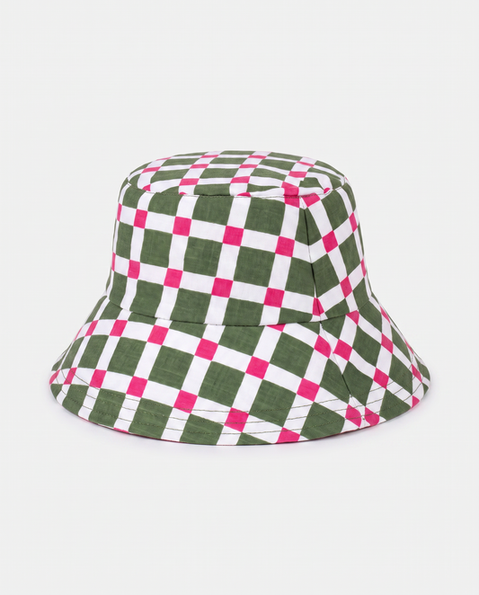 A bucket hat with a green, white, and hot pink checkered pattern, photographed against a light gray background.