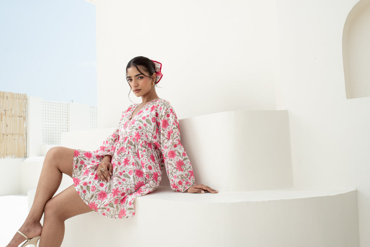 Model wearing Maison Indē pink floral hand block print cotton dress