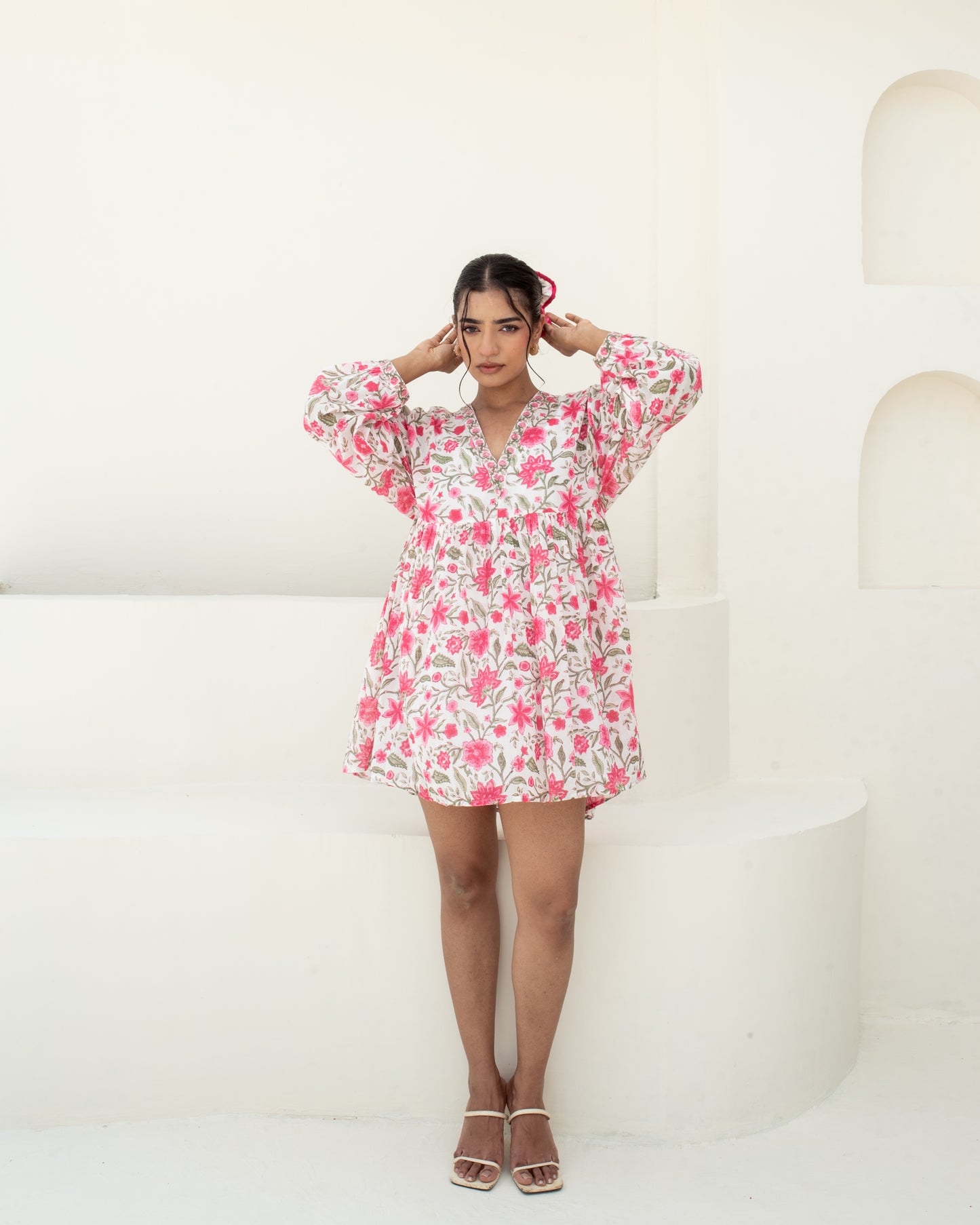 Model wearing the Anar Bagh pink floral hand block printed cotton mini dress