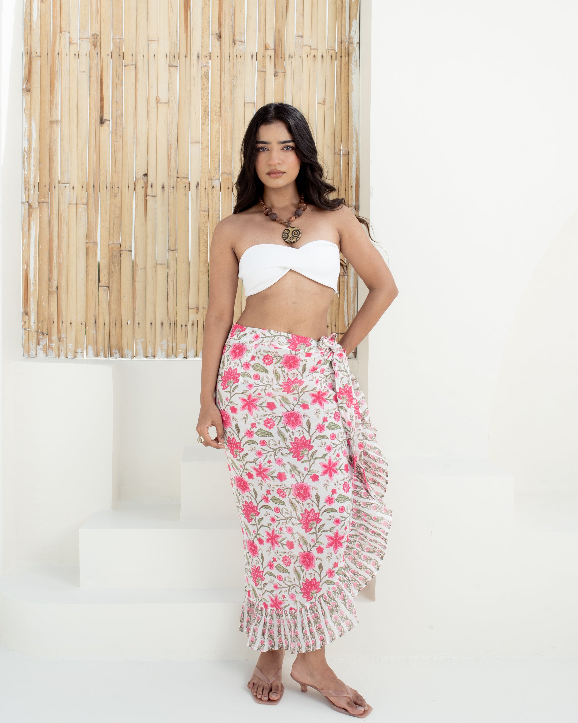 Model wearing the Anar Bagh pink floral hand block printed cotton wrap sarong