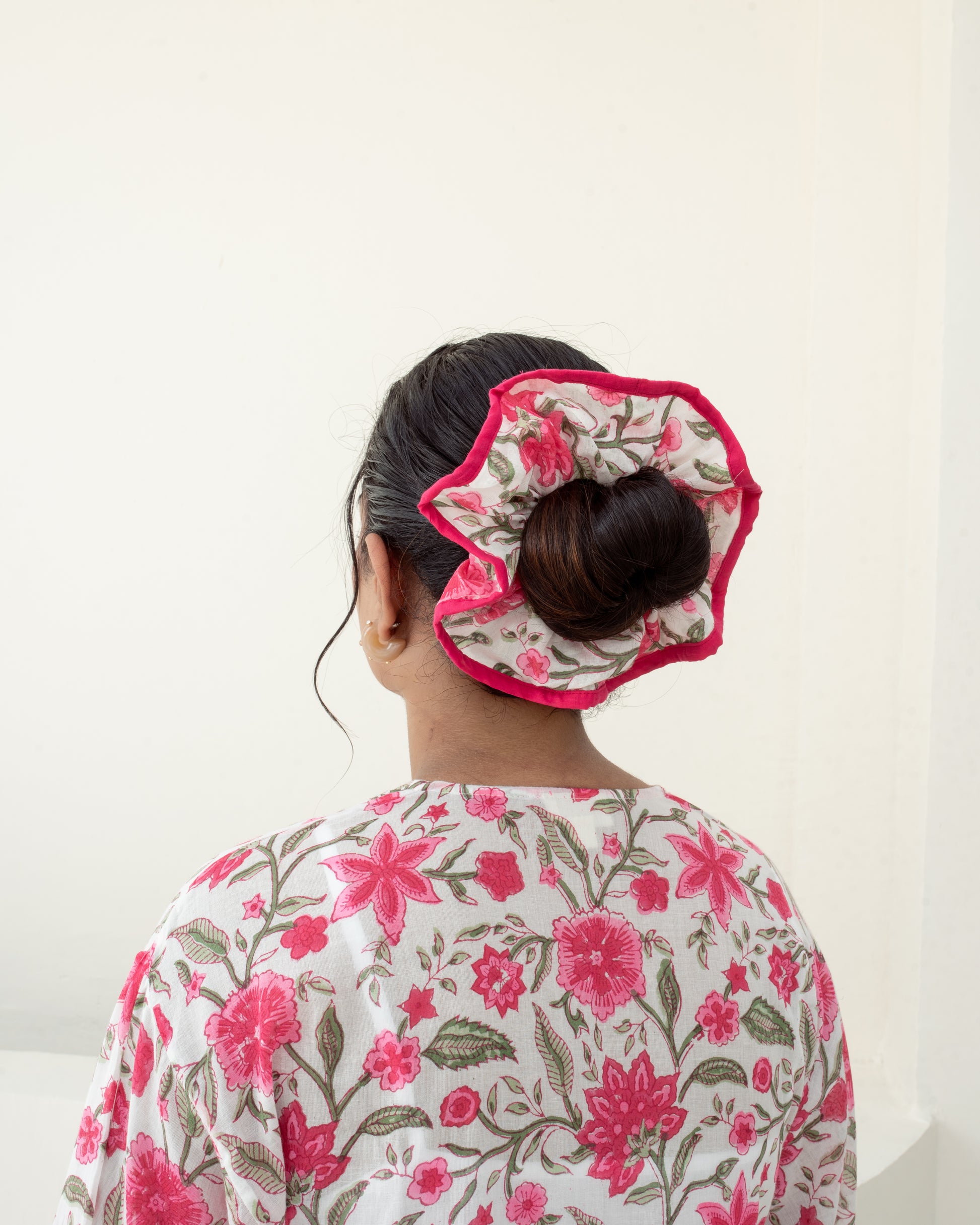 Anar Bagh Pink scrunchie closeup on model hair