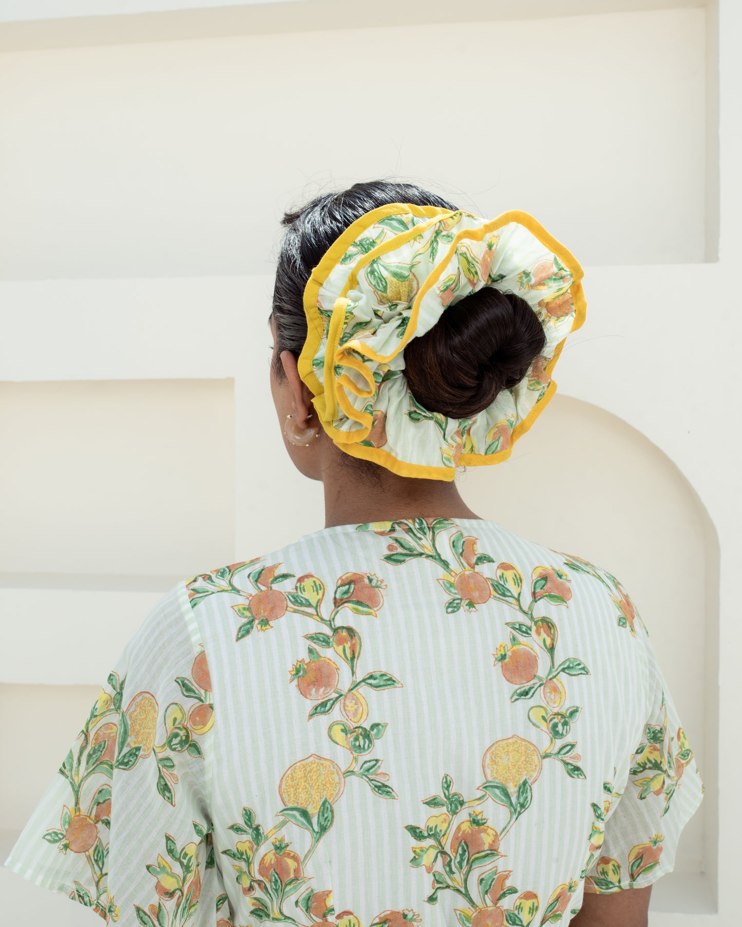 Anar Bagh Yellow Scrunchies on model's hair closeup of details