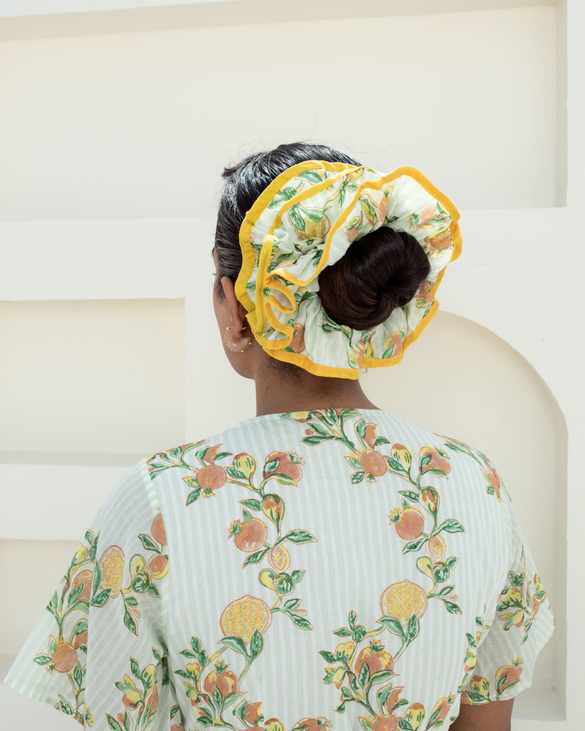 Anar Bagh Yellow Scrunchies on model's hair closeup of details