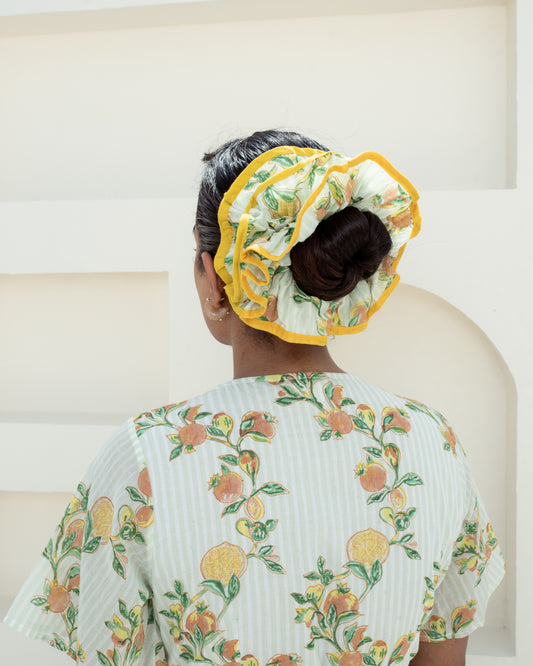 Anar Bagh Yellow Scrunchies on model's hair closeup of details