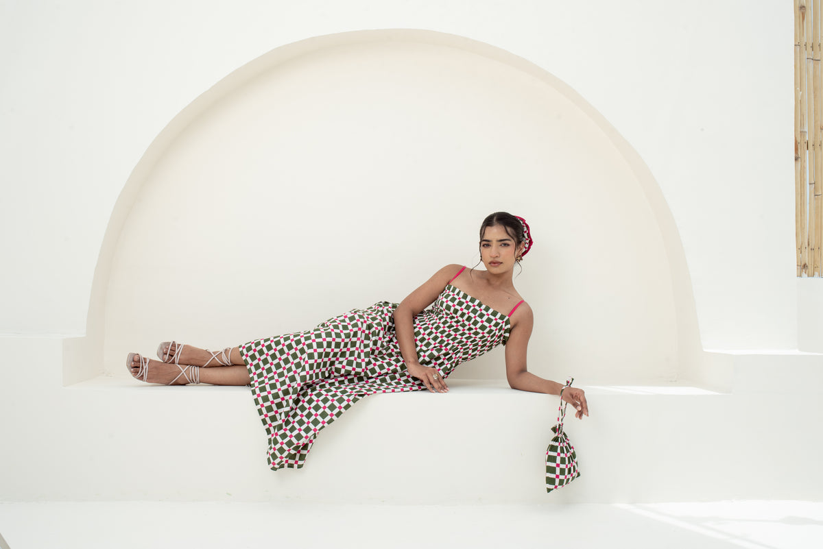 Model wearing Maison Indē pink and green checked cotton dress