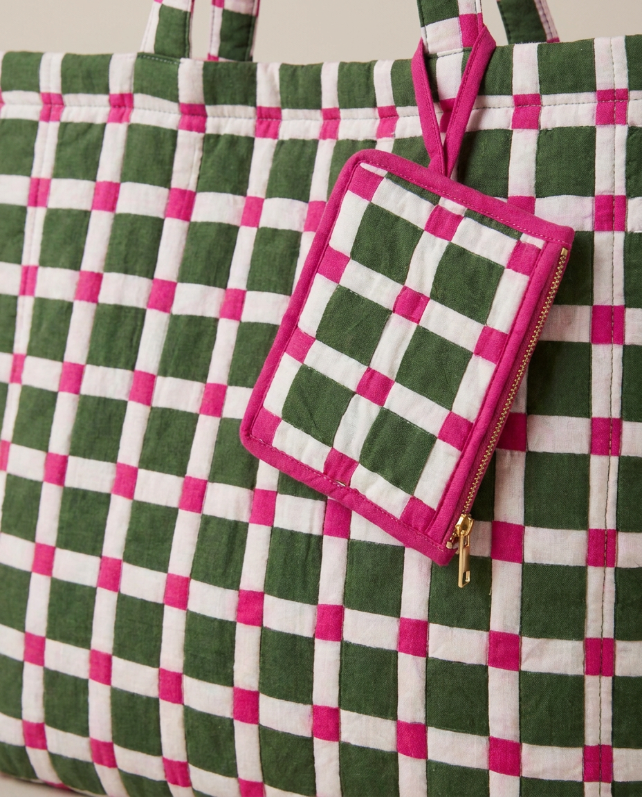 A green, white, and pink checkered quilted tote bag with a matching zippered pouch, shown against a neutral beige background.