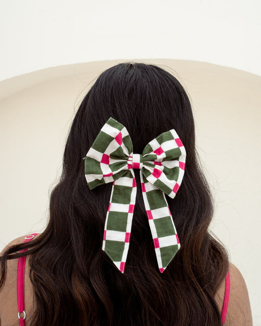 Garden checks hair bow hand block printed on 100% cotton on model hair closeup