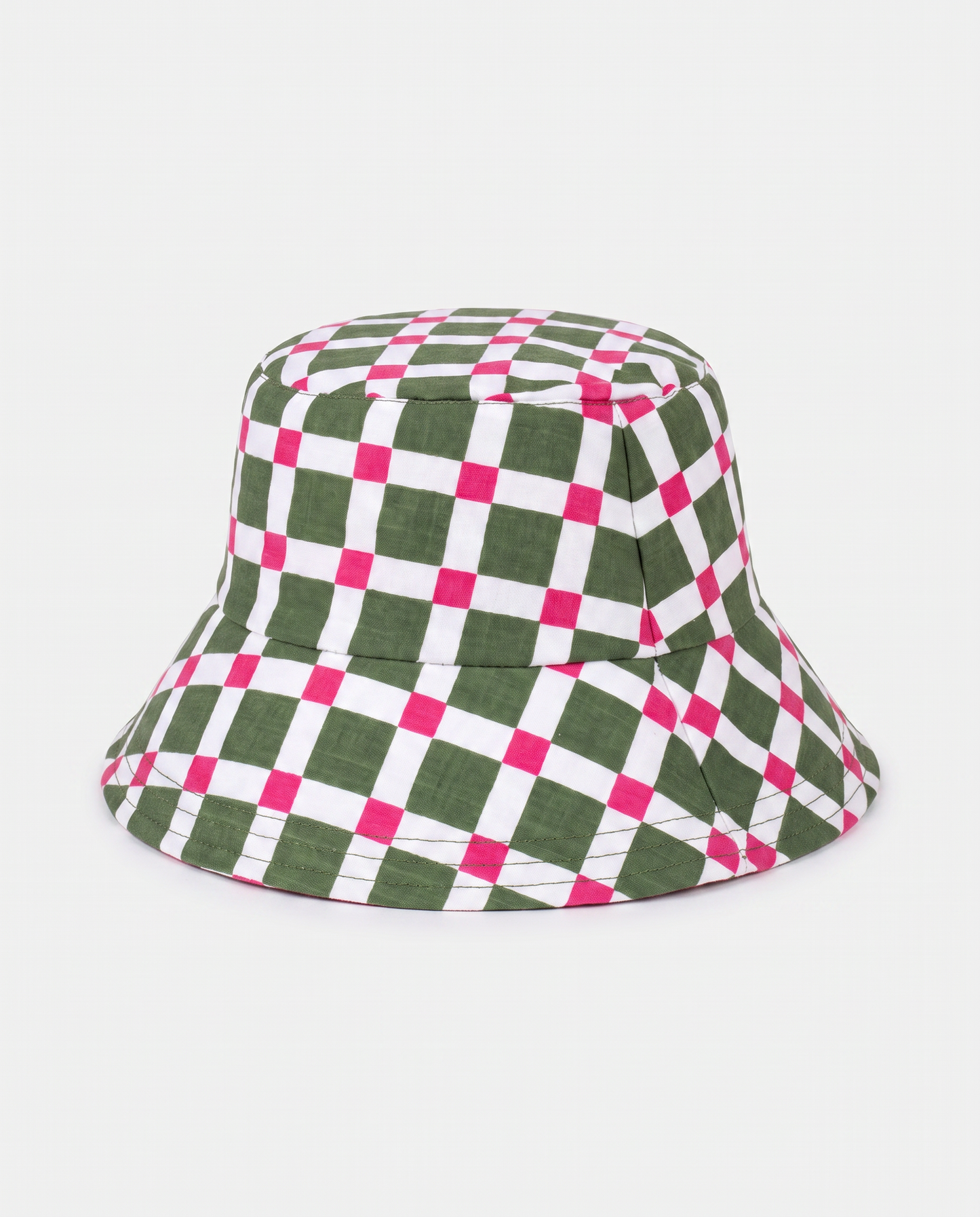 A bucket hat with a green, white, and hot pink checkered pattern, photographed against a light gray background.