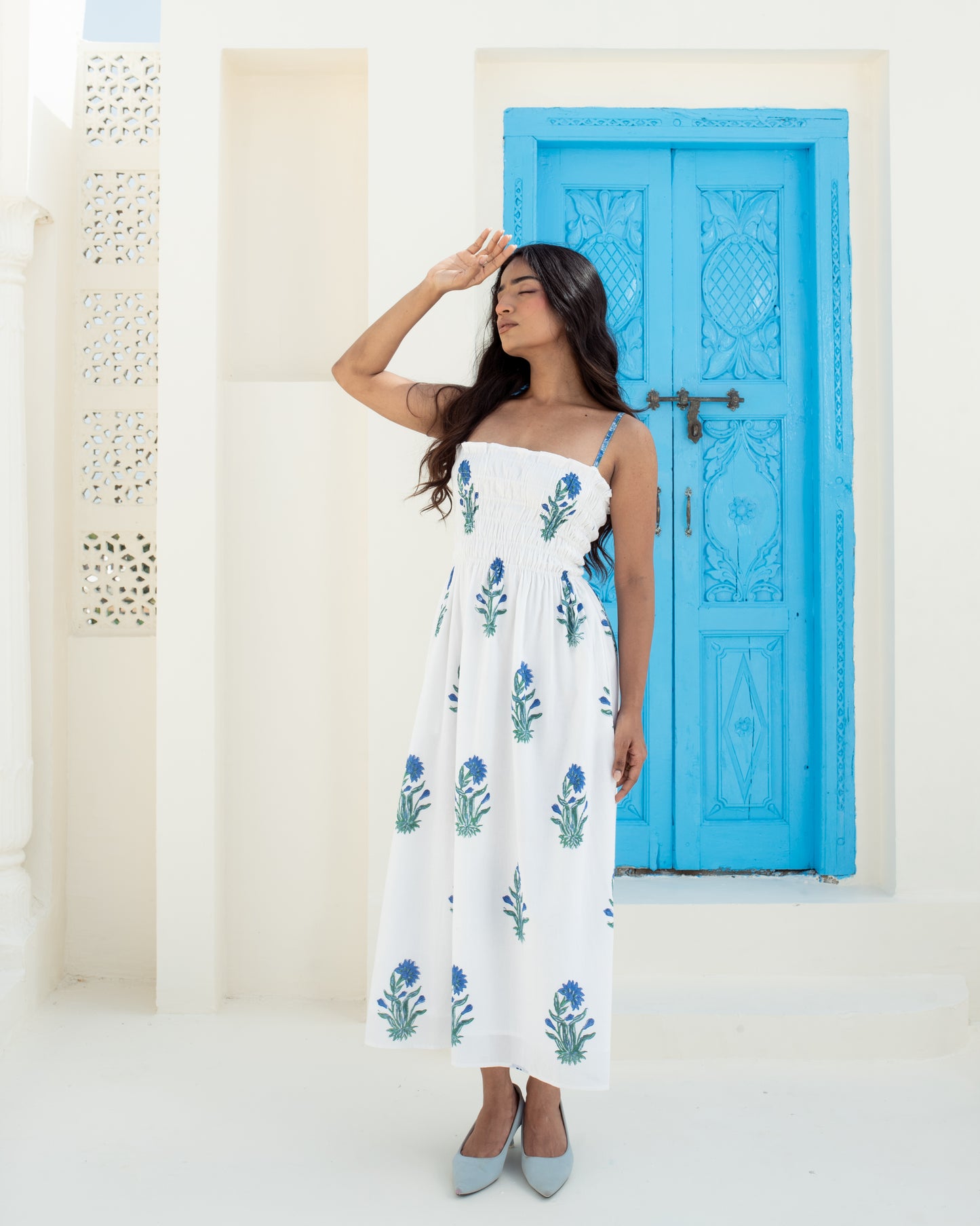 Close-up of the Blue Riviera dress smocked bodice and blue floral block print
