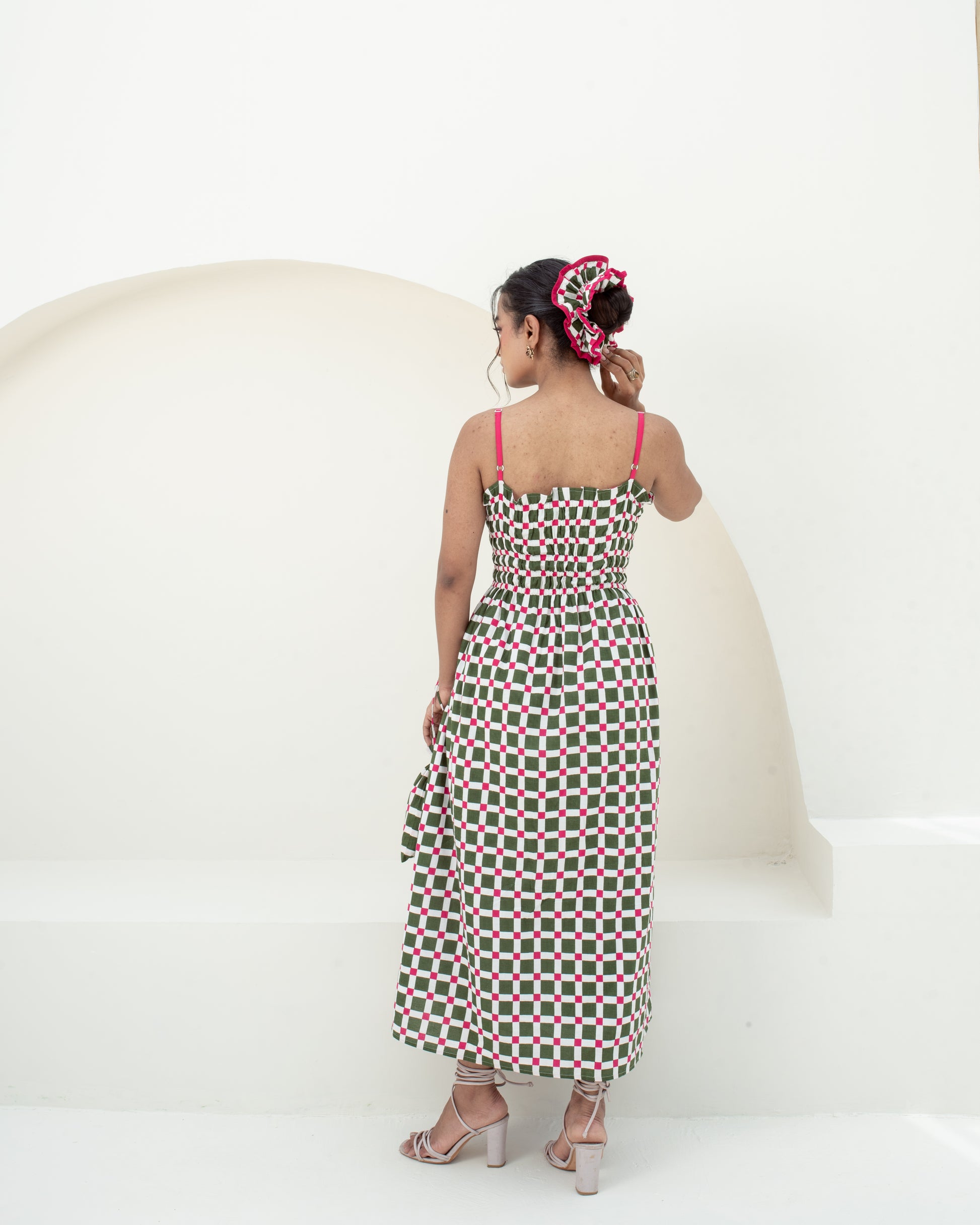 Full-length back view of the Garden Checks cotton midi dress with adjustable pink straps